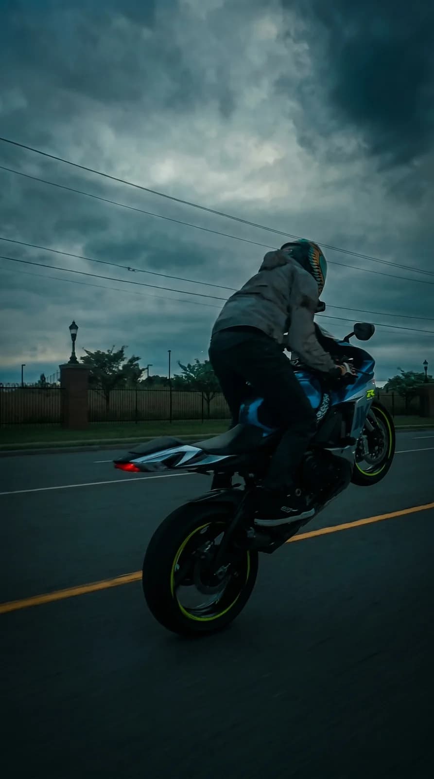 The motorcycle at dusk, deep cyan grade