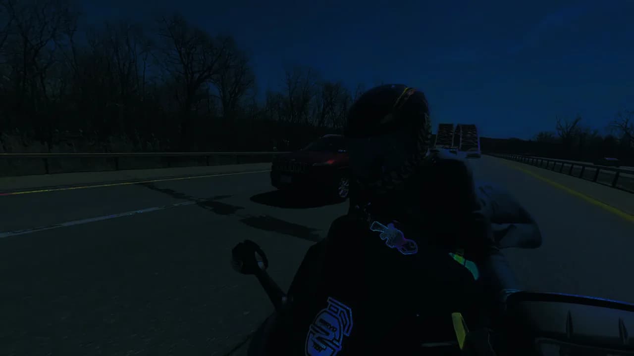 The open highway ahead, seen over the rider